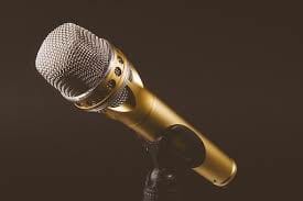 Microphone on a microphone stand. smart money bro.