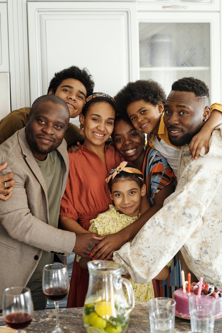 family taking a group photo smart money bro