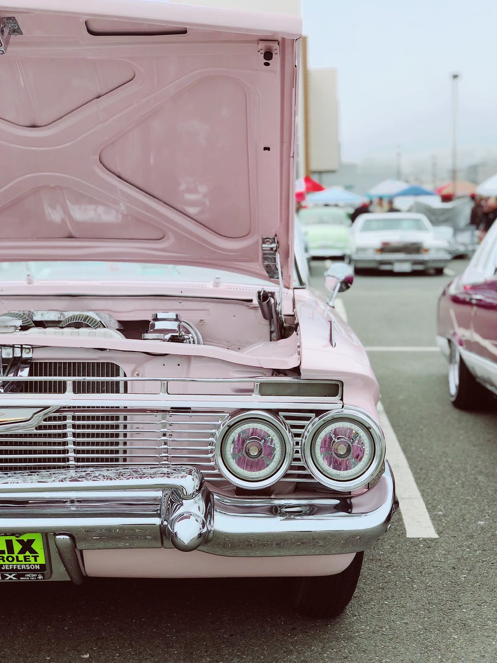 white vehicle in road close up photography smart money bro