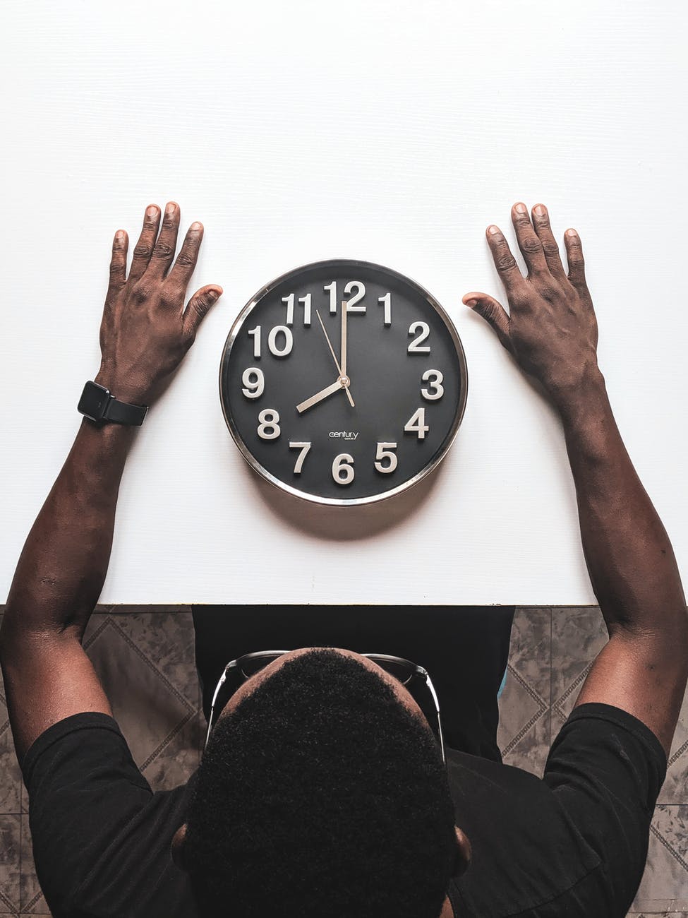 round silver colored wall clock. smart money bro