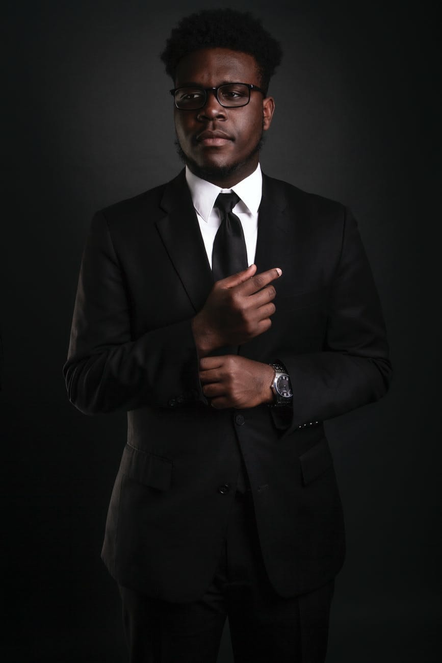 man wearing suit smart money bro