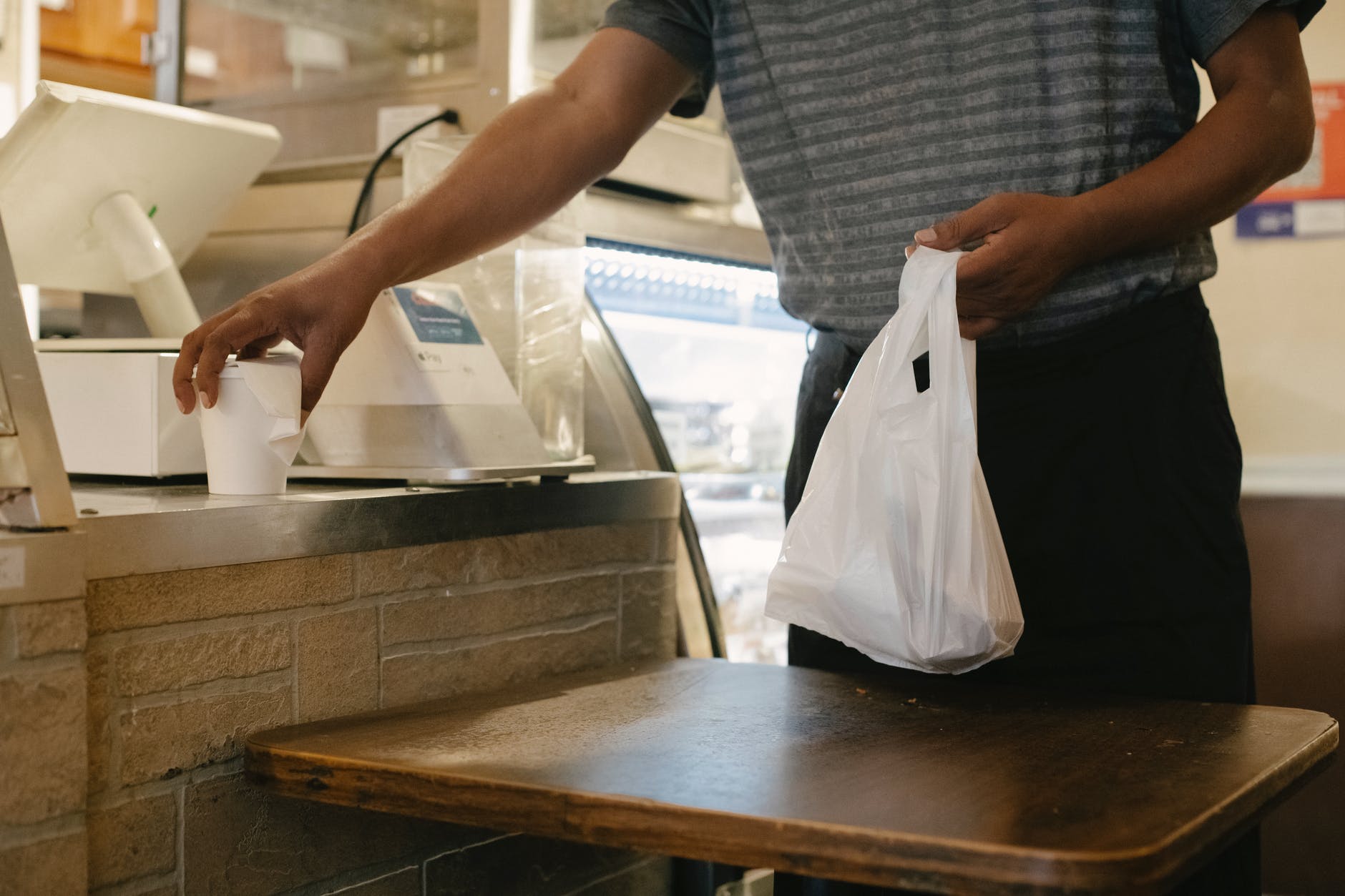 crop man with purchases in store, smart money bro